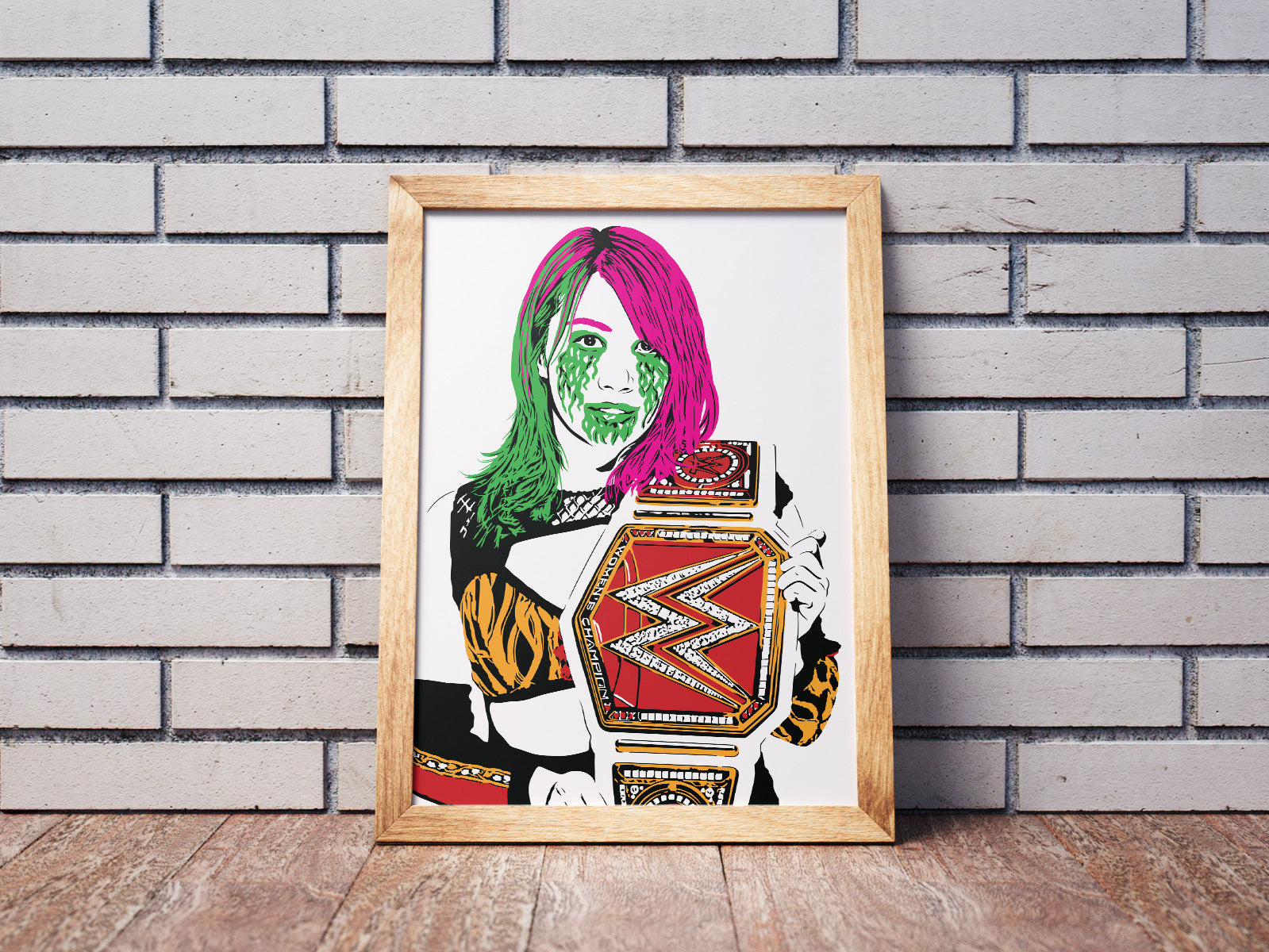 illustration of pro wrestler Asuka with pink and green hair and facepaint holding the WWE womens world championship belt framed art print on the floor