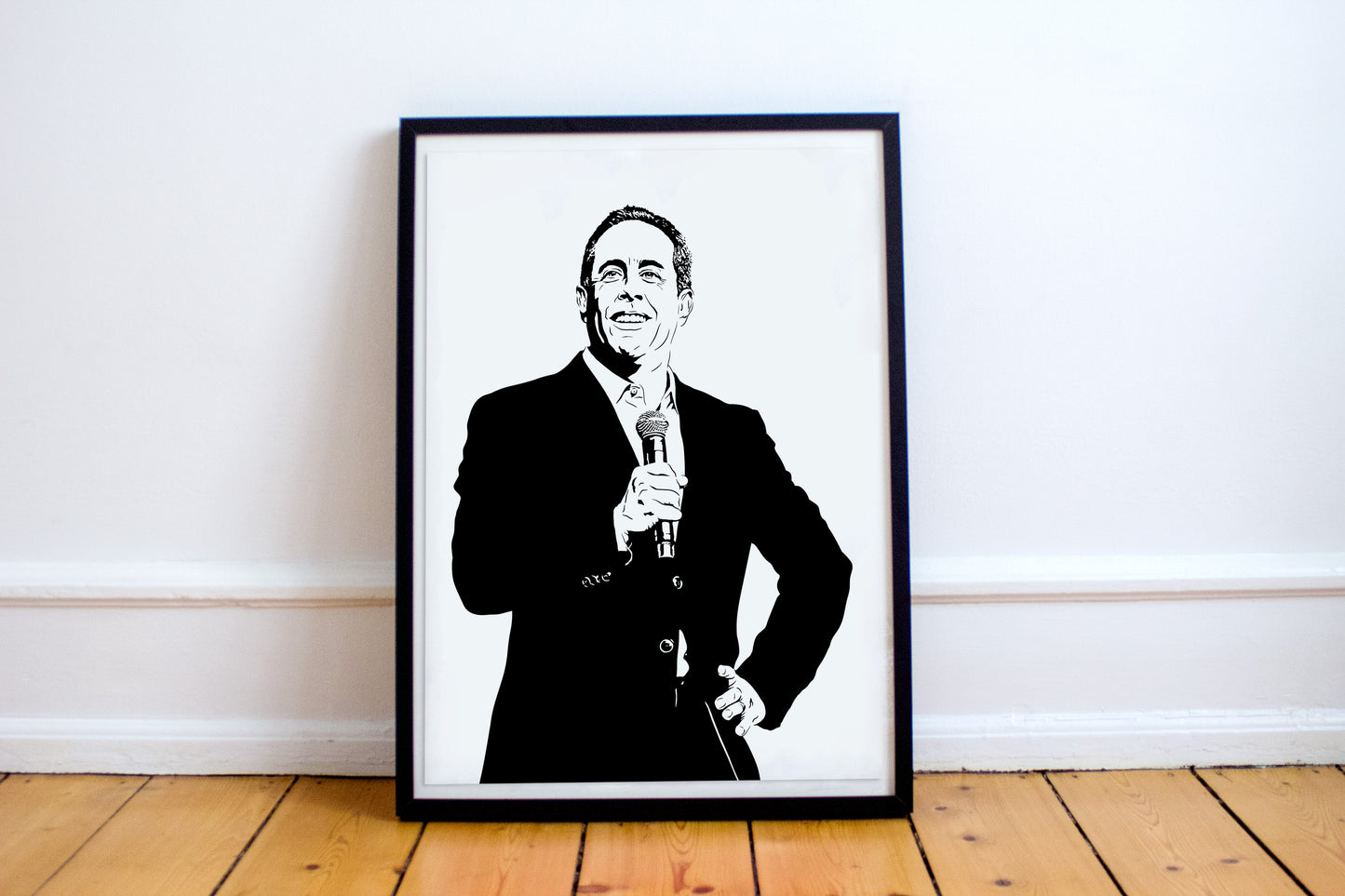 black and white digital illustration of jerry seinfeld performing stand-up comedy on stage with a microphone framed print