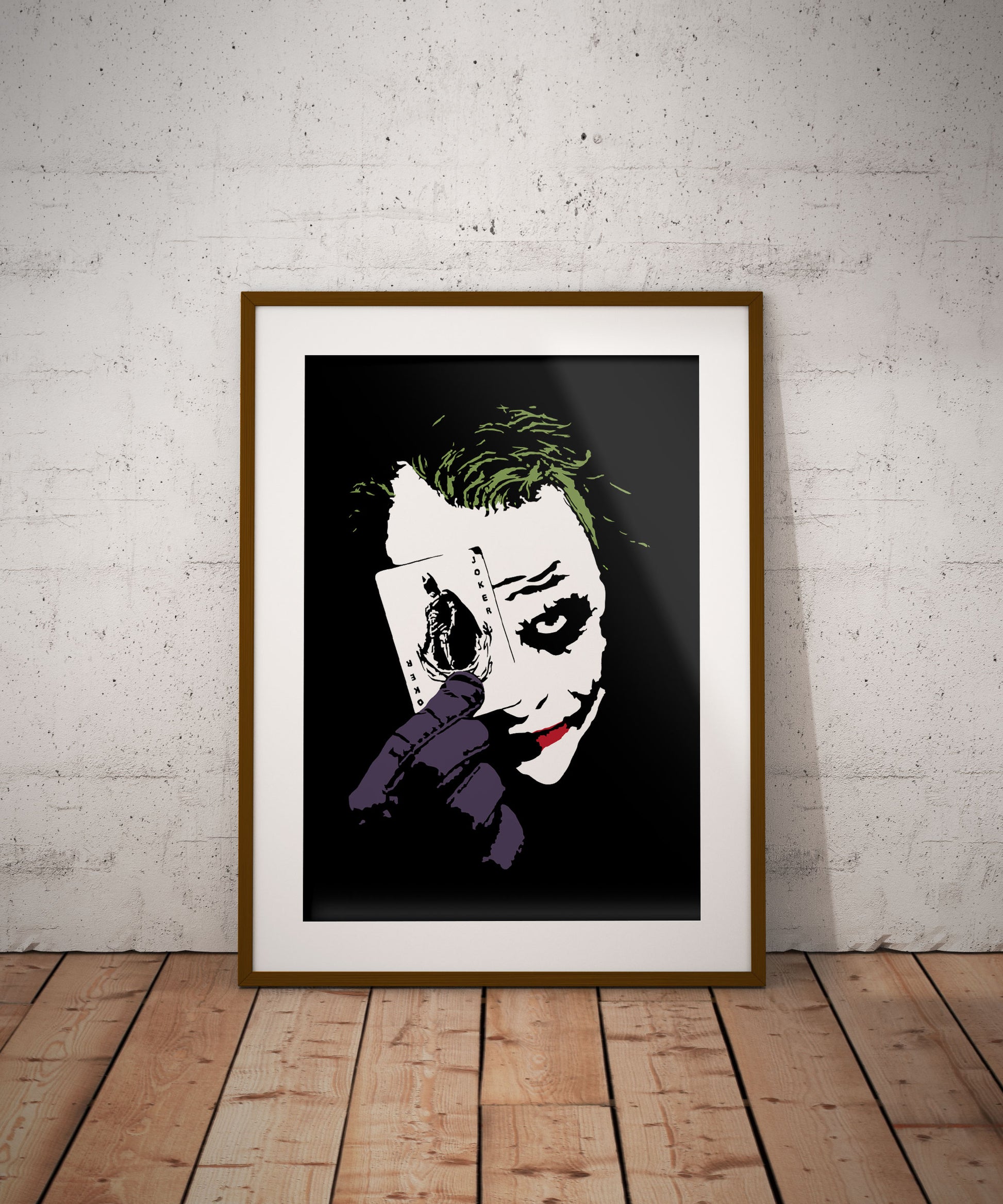 black and white digital illustration with spot colors close up portrait of heath ledger as the joker holding a playing card framed poster