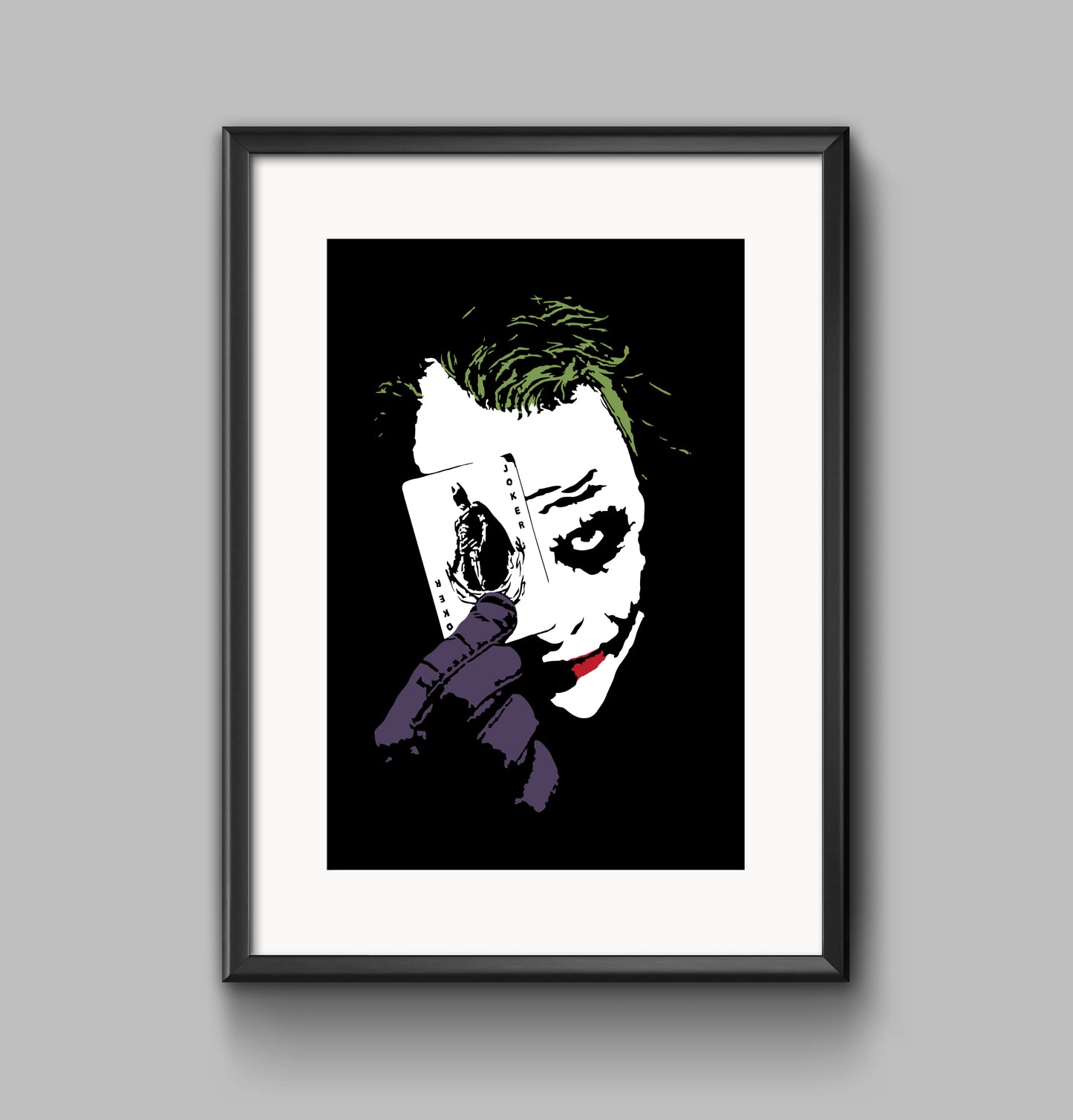 black and white digital illustration with spot colors close up portrait of heath ledger as the joker holding a playing card framed print