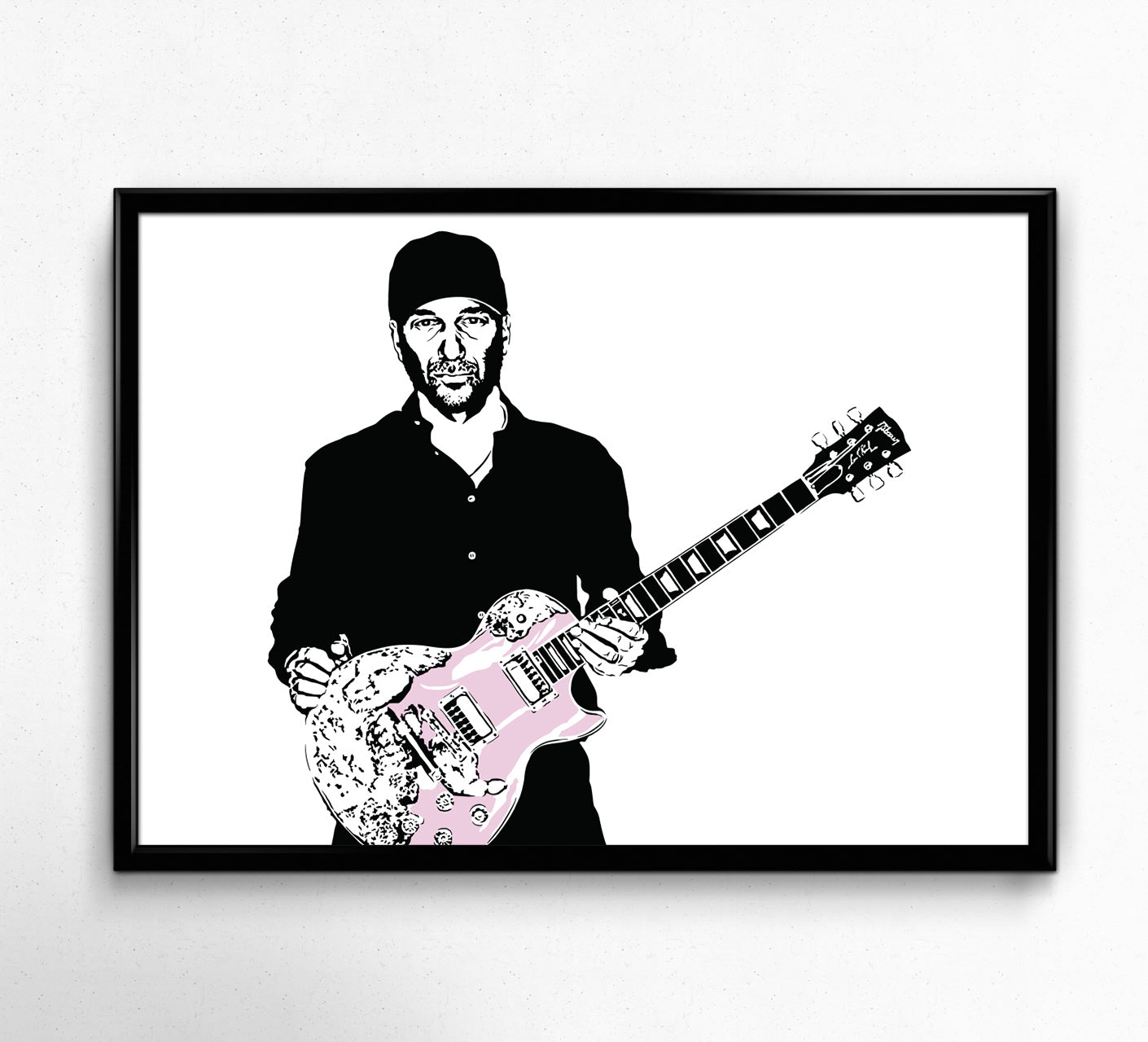 black and white digital illustration of tom morello playing guitar with a pink guitar framed poster